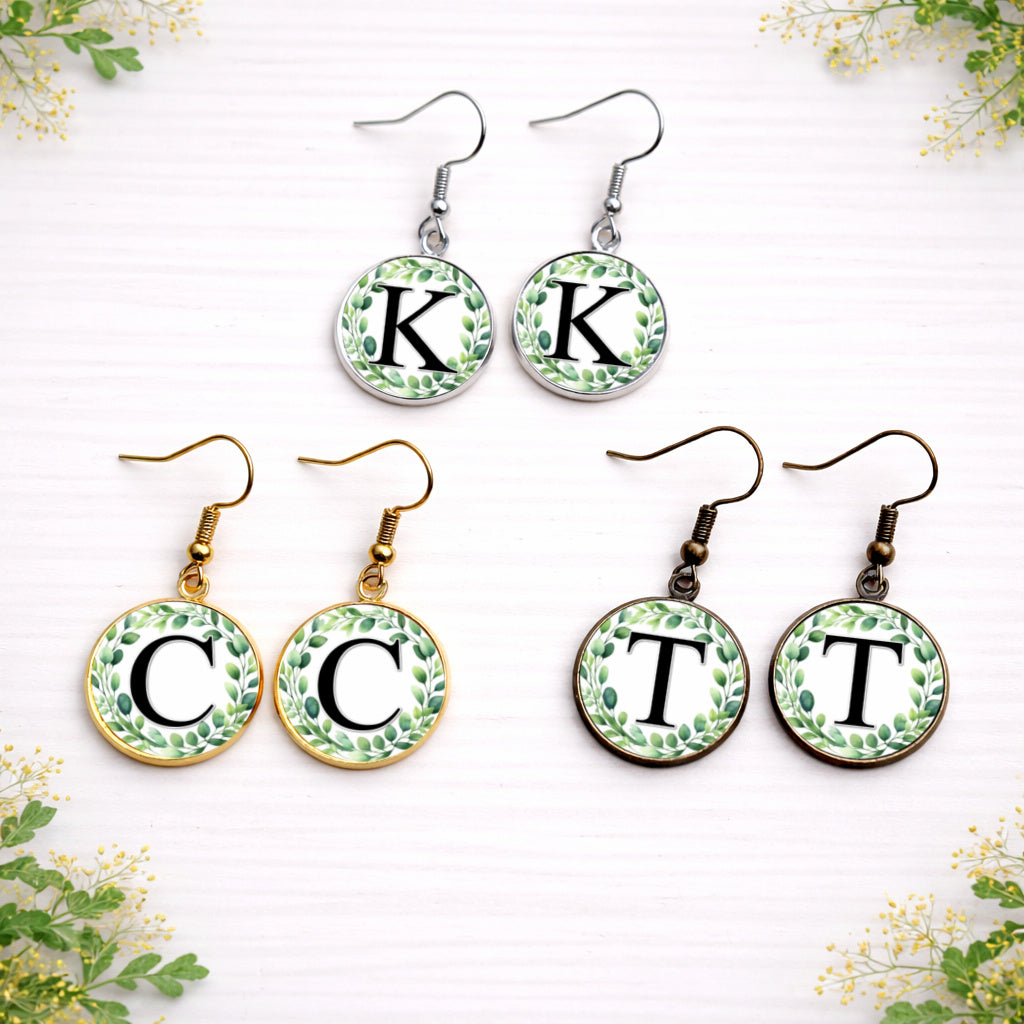 Personalised eucalyptus initial earrings in gold, silver and bronze finishes with botanical wreath design