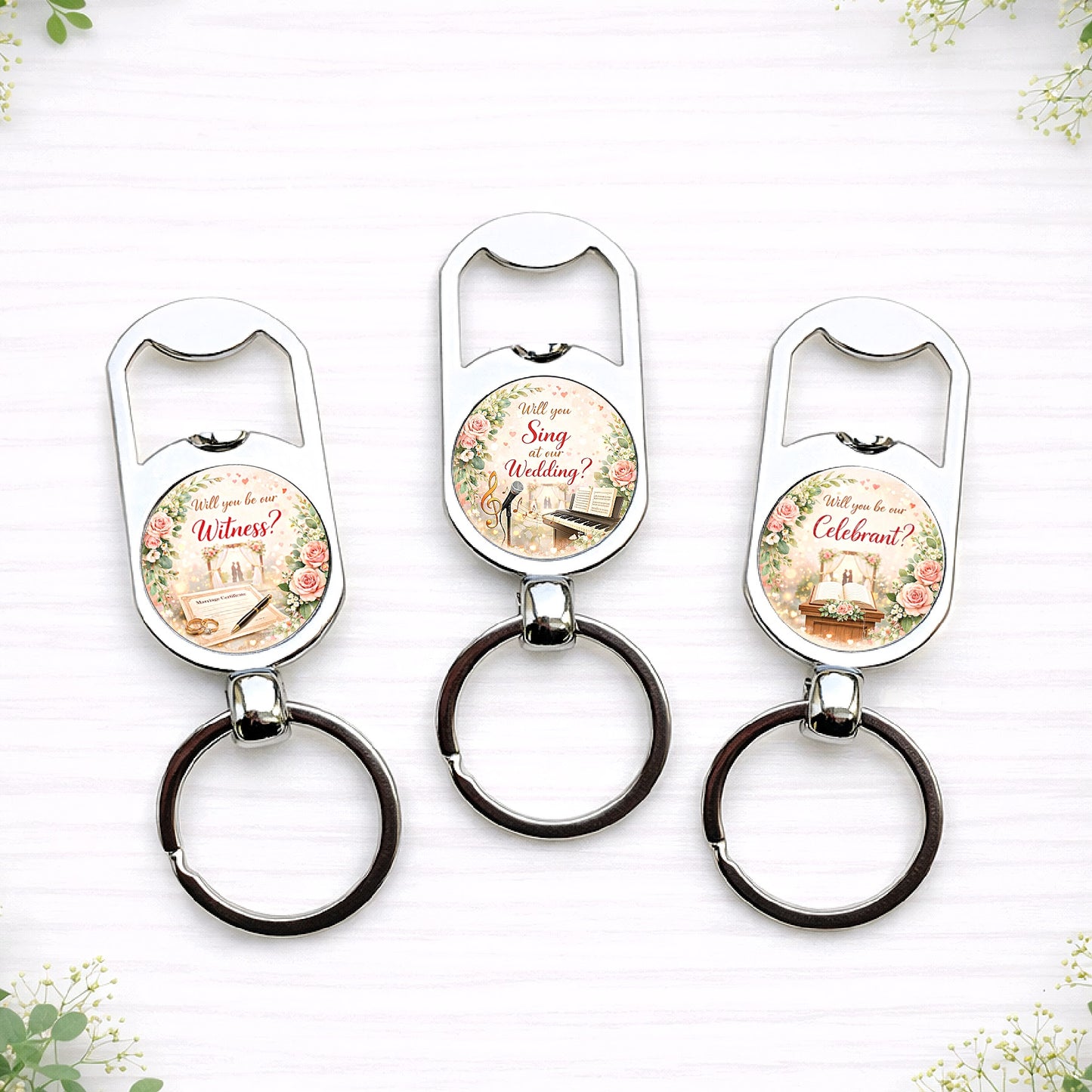 Personalised wedding role proposal bottle opener keyrings with floral designs asking “Will you Read at our Wedding?”, “Will you be our Celebrant?” and similar roles