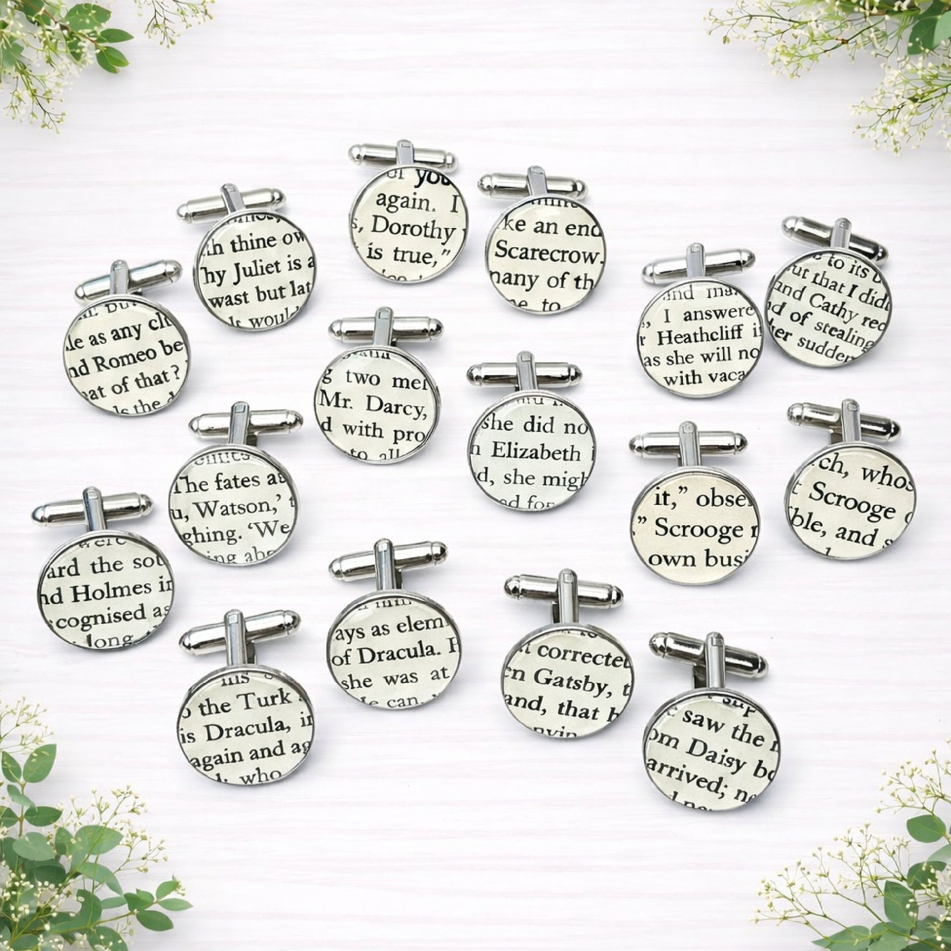 Round silver cufflinks featuring reclaimed vintage book pages under a glossy dome finish.