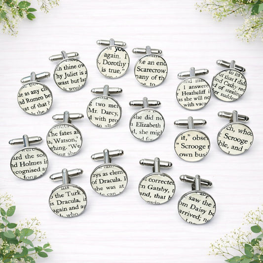 Round silver cufflinks featuring reclaimed vintage book pages under a glossy dome finish.