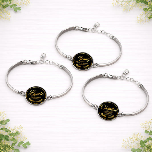 Personalised black and gold bridal party bracelets featuring names and wedding roles for bridesmaid, maid of honour and mother of the bride.