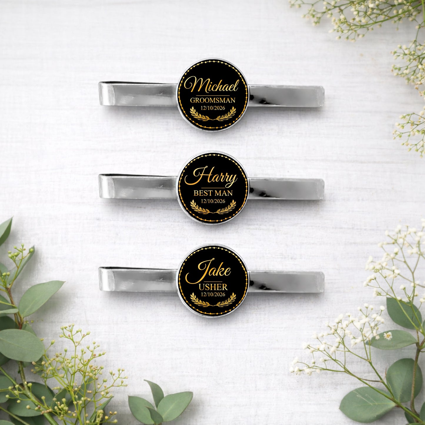Personalised wedding tie bar with name and role in black and gold seal design