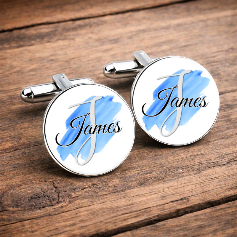 Personalised colour splash name cufflinks with custom wedding colours on a wooden background