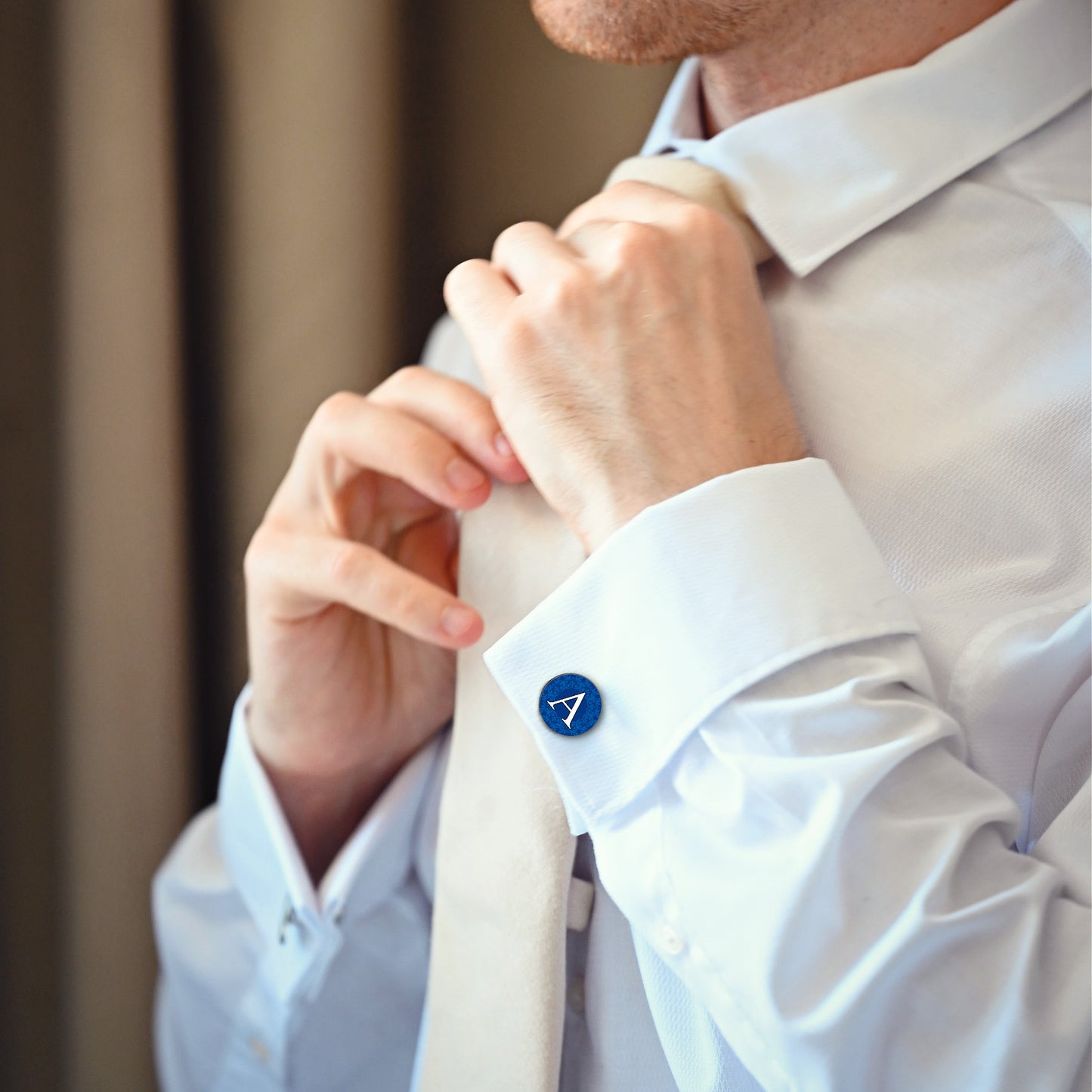 Navy blue initial cufflinks worn with wedding shirt and tie