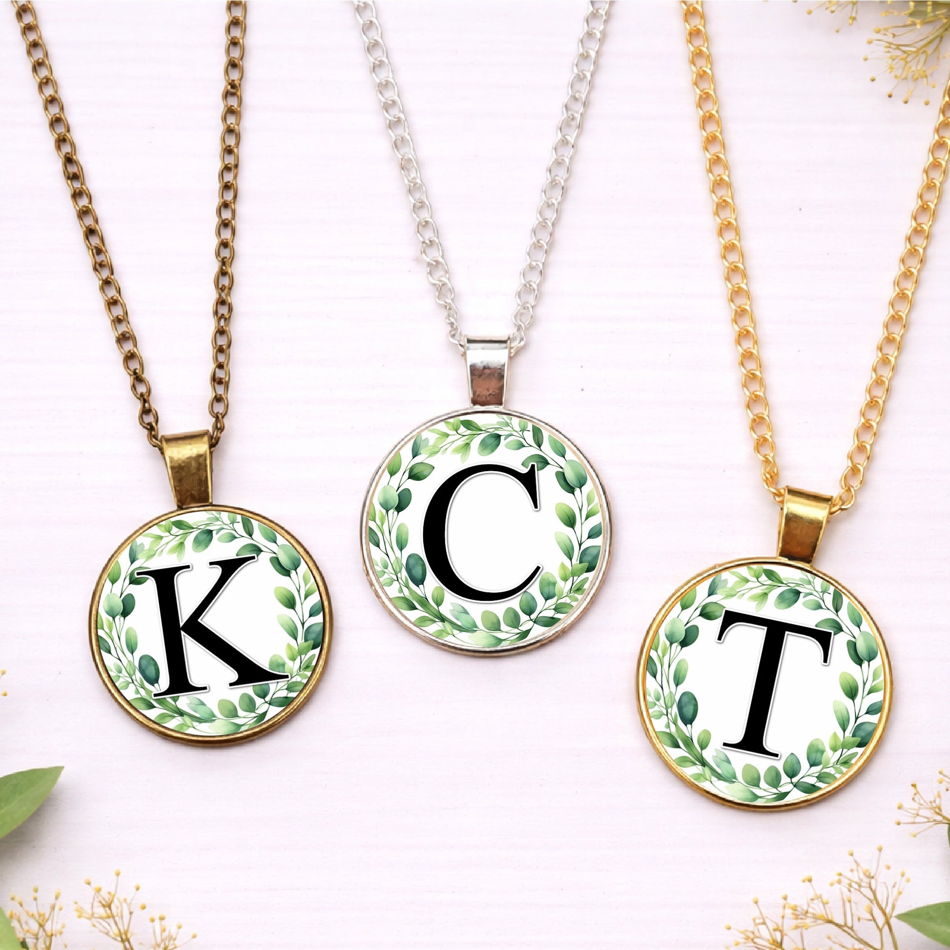 Personalised eucalyptus wreath initial necklace in gold, silver and bronze finishes with custom letter pendant