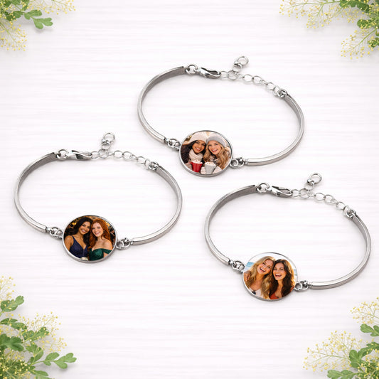 Personalised photo bracelets with custom images of friends displayed in circular charms on silver adjustable bracelets.