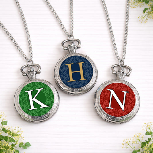 Personalised silver pocket watches with custom wedding colour backgrounds and monogram initials, designed as bespoke groomsmen gifts with matching gift box and chain options.