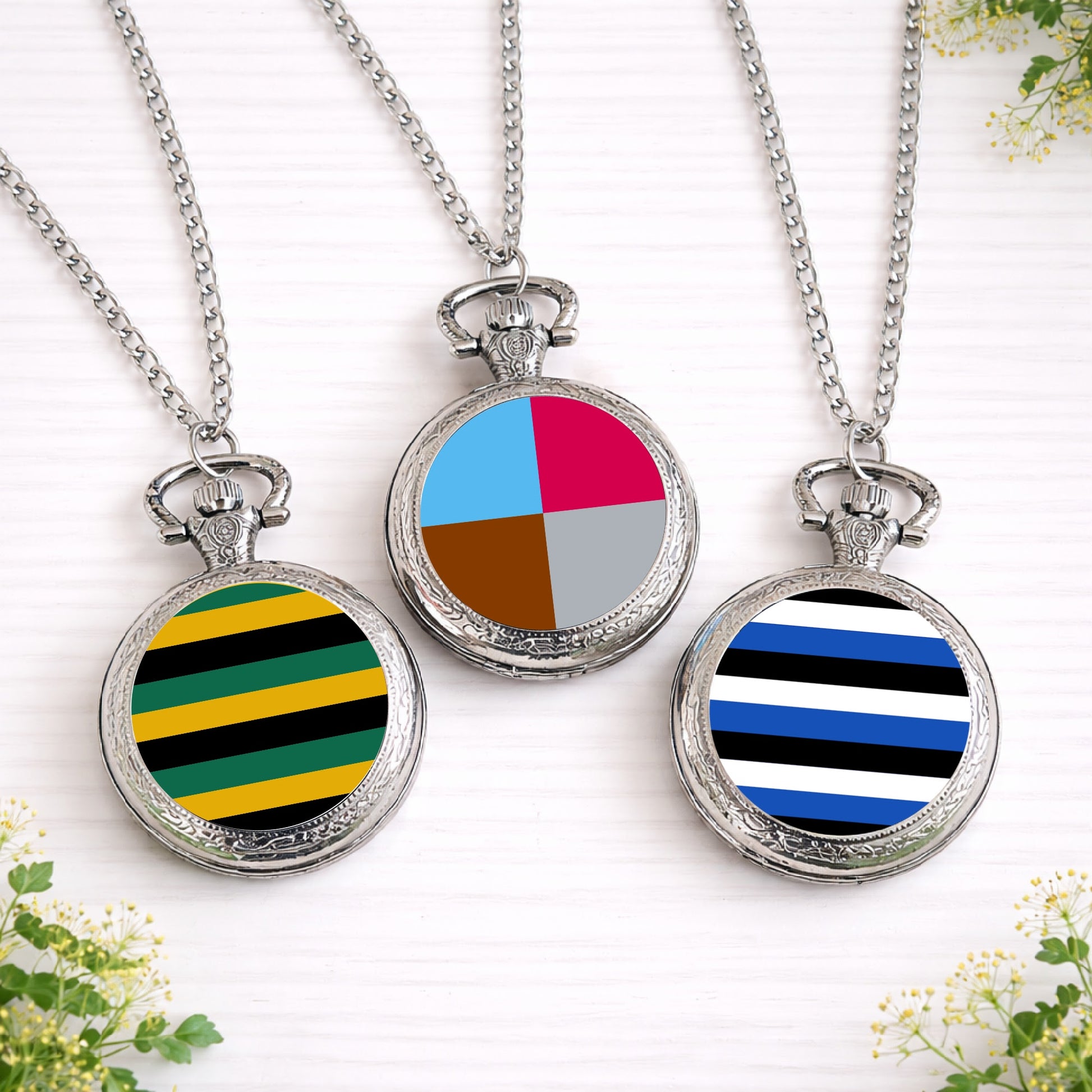 Silver pocket watches featuring custom football and rugby team colour designs in stripes and quarters, created as sports-themed groomsmen gifts.