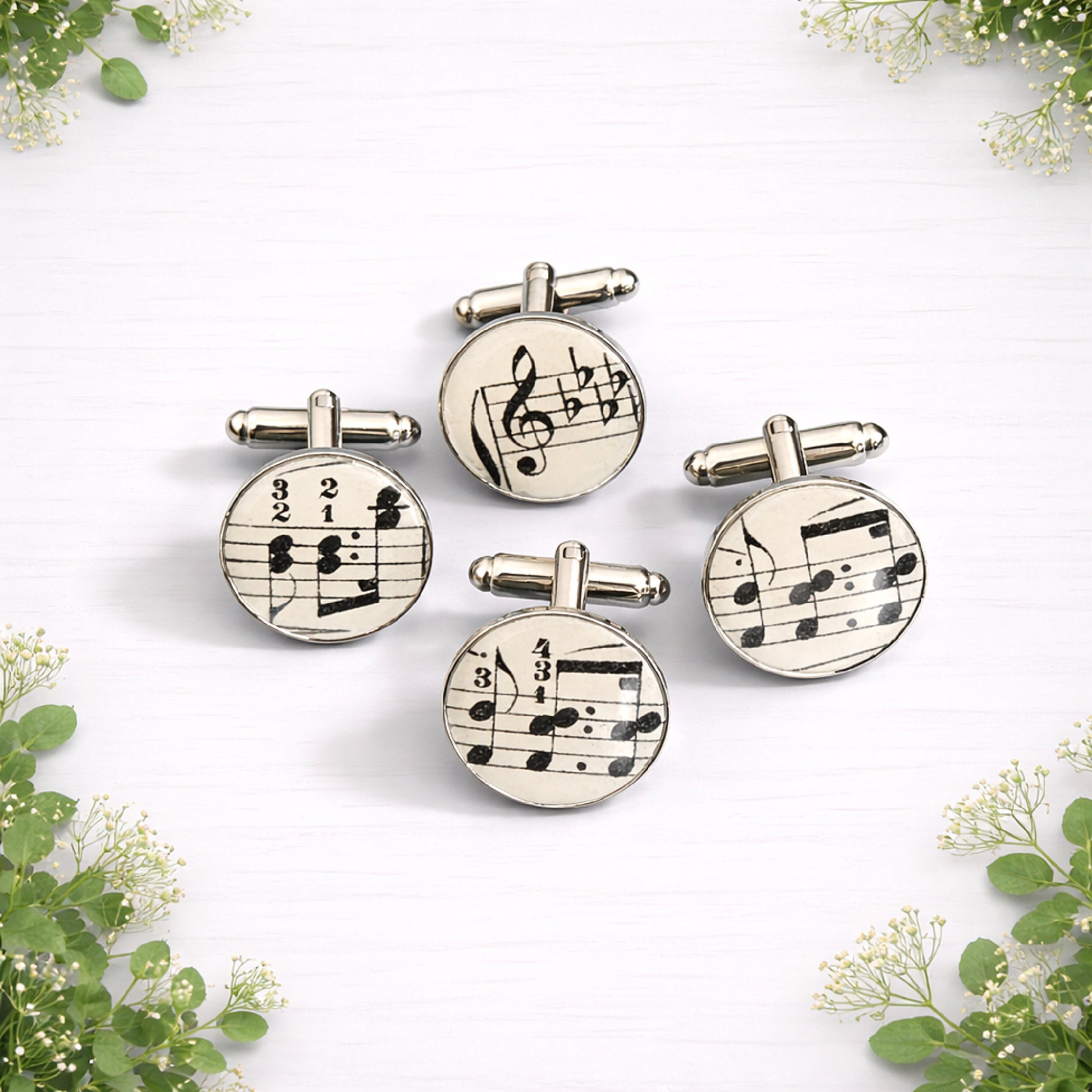 Round silver cufflinks featuring genuine vintage sheet music under a glossy dome finish.