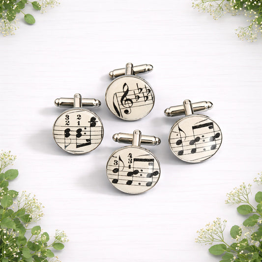 Round silver cufflinks featuring genuine vintage sheet music under a glossy dome finish.