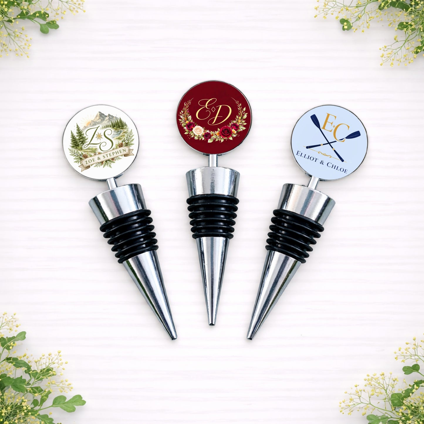 Personalised wedding logo bottle stoppers featuring custom monograms and floral crest designs in various styles.